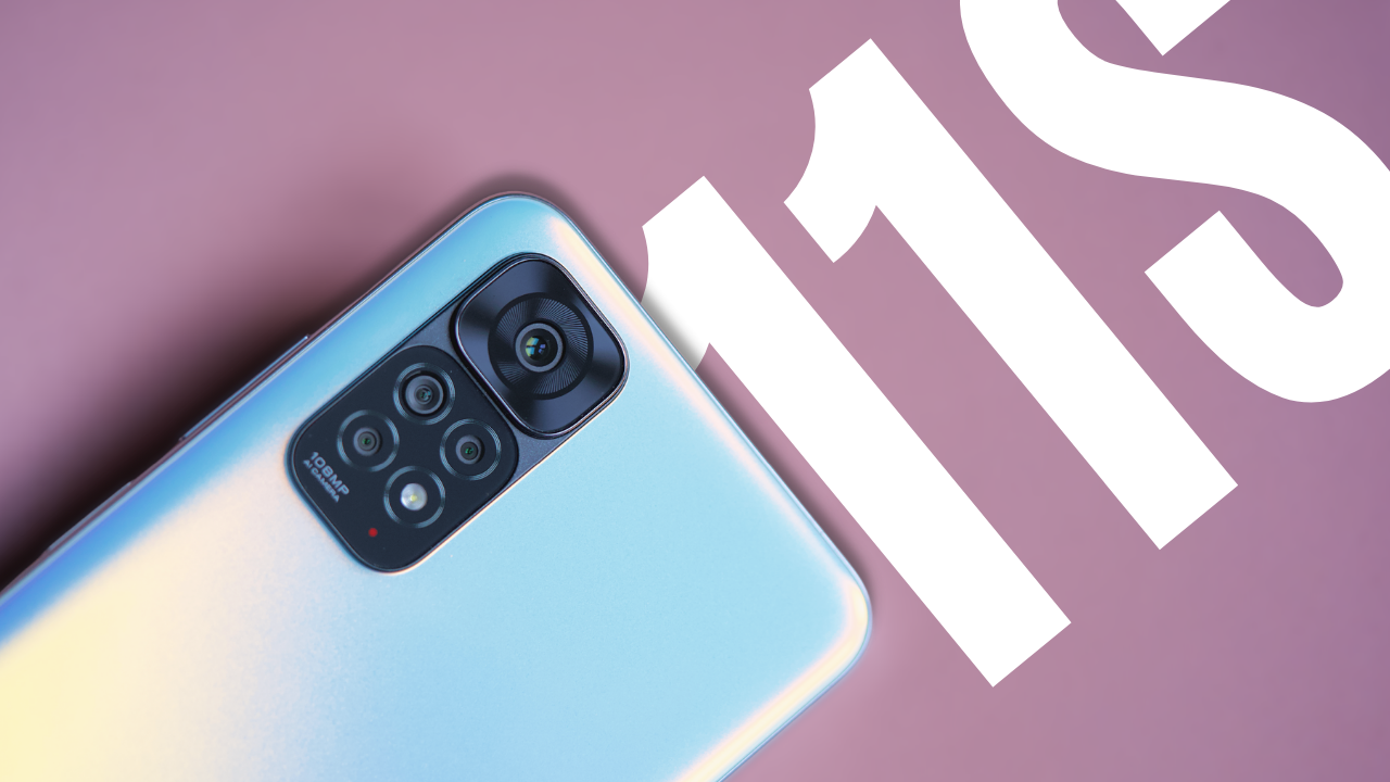 Close-up of Xiaomi Redmi Note 11S smartphone camera on a pink background.
