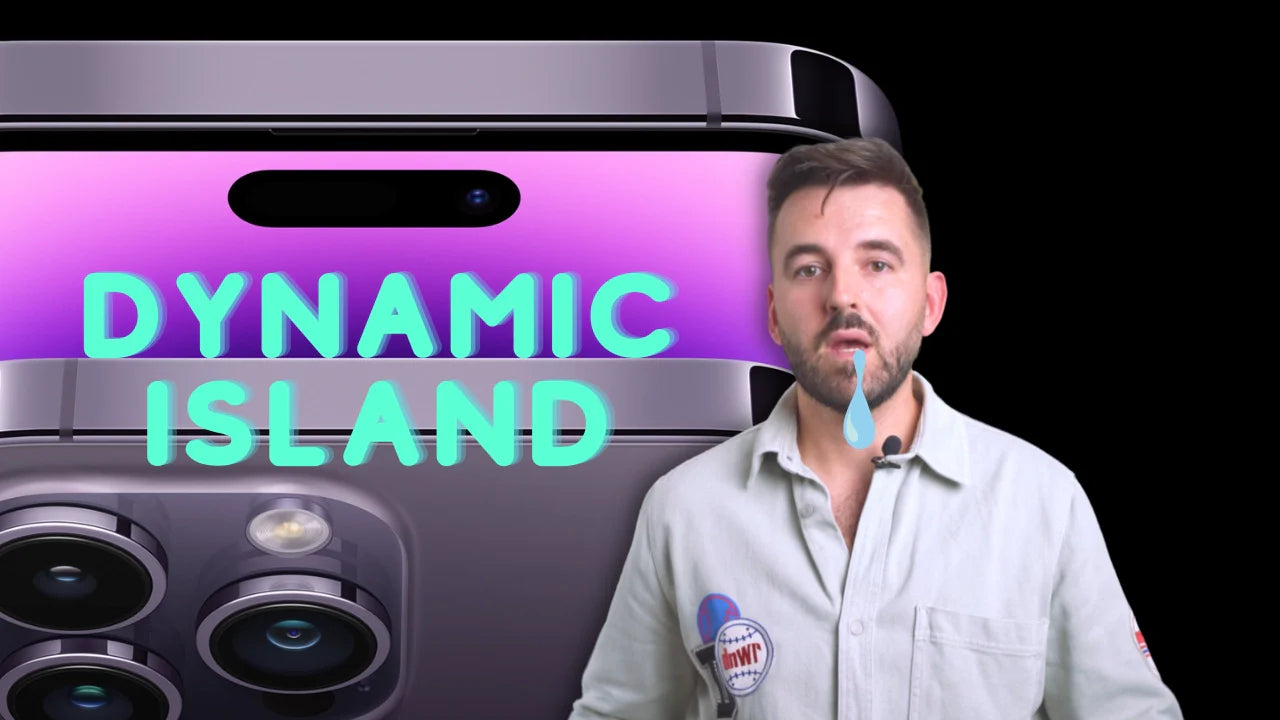 Close-up of iPhone 14 camera with dynamic island feature text and expressive man in white shirt, illustrating new technology.