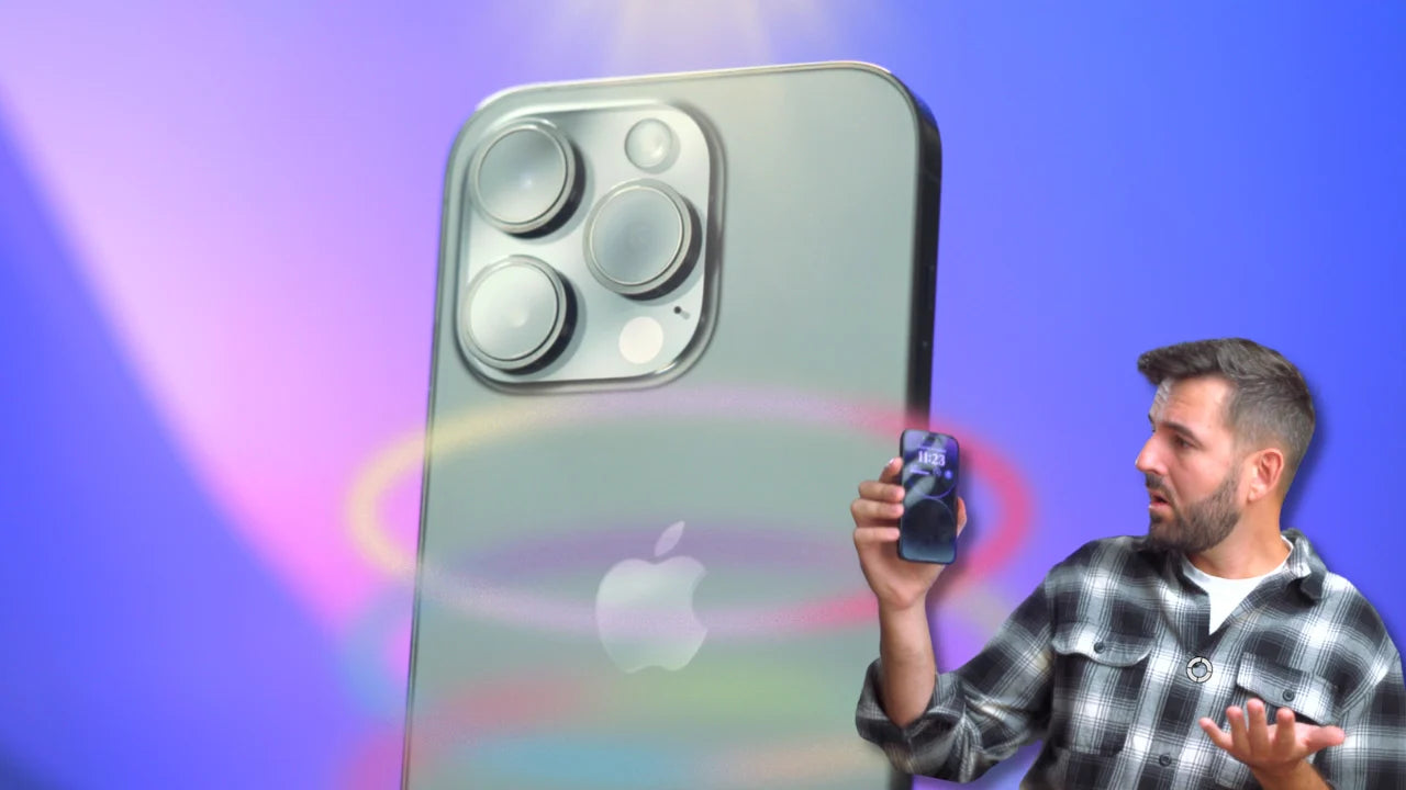 Man holding iPhone 14 Pro with colorful backdrop.