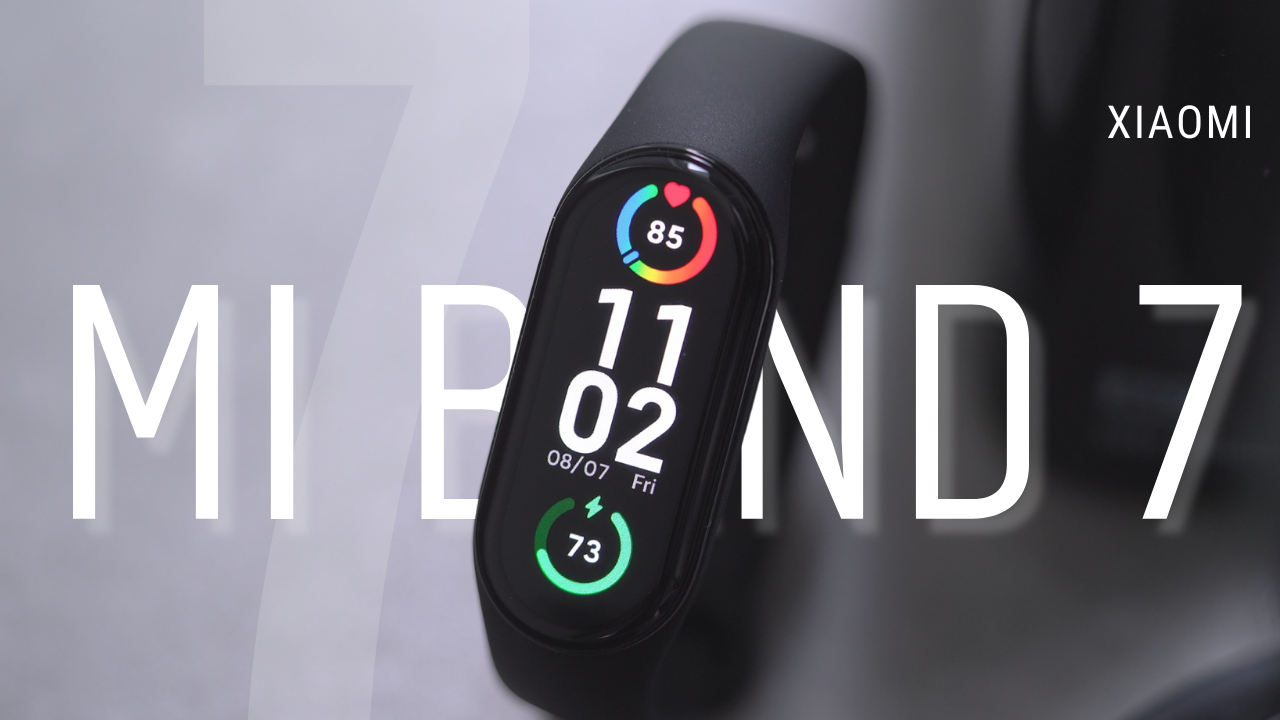 Xiaomi Mi Band 7 close-up with fitness tracking display showing heart rate and date features.