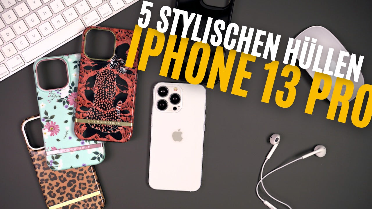 Various stylish iPhone 13 Pro cases displayed with smartphone, keyboard, and earphones on a desk setting.