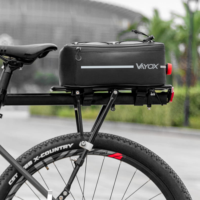 Vayox VA0166 8L black bike rack bag securely attached to bicycle for convenient item transport.