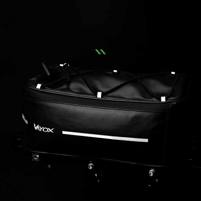 Vayox VA0166 8L black bike rack bag with reflective accents on a dark background.