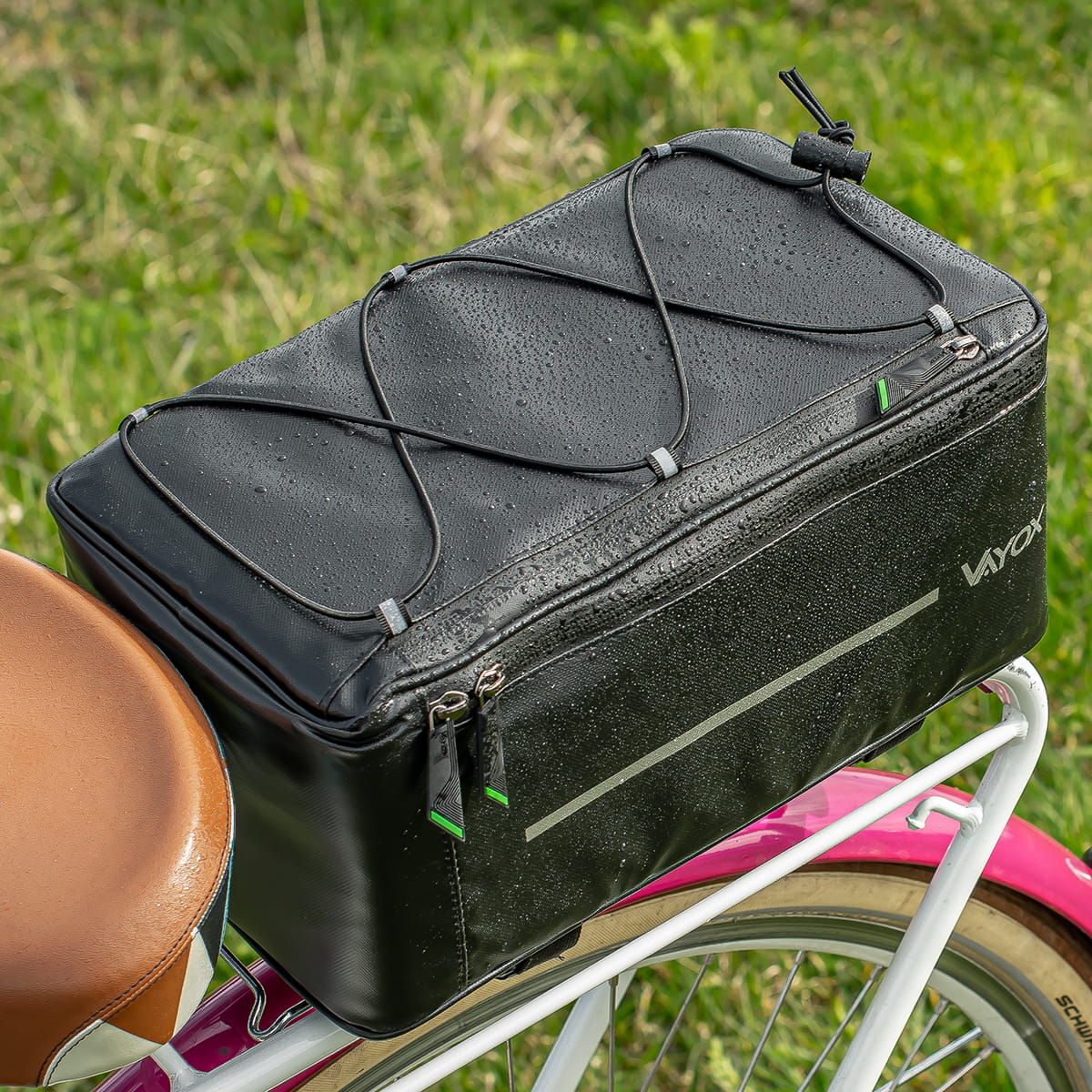 Vayox VA0166 8L black bike pannier on rear rack of bicycle, compact and roomy design for easy transport.
