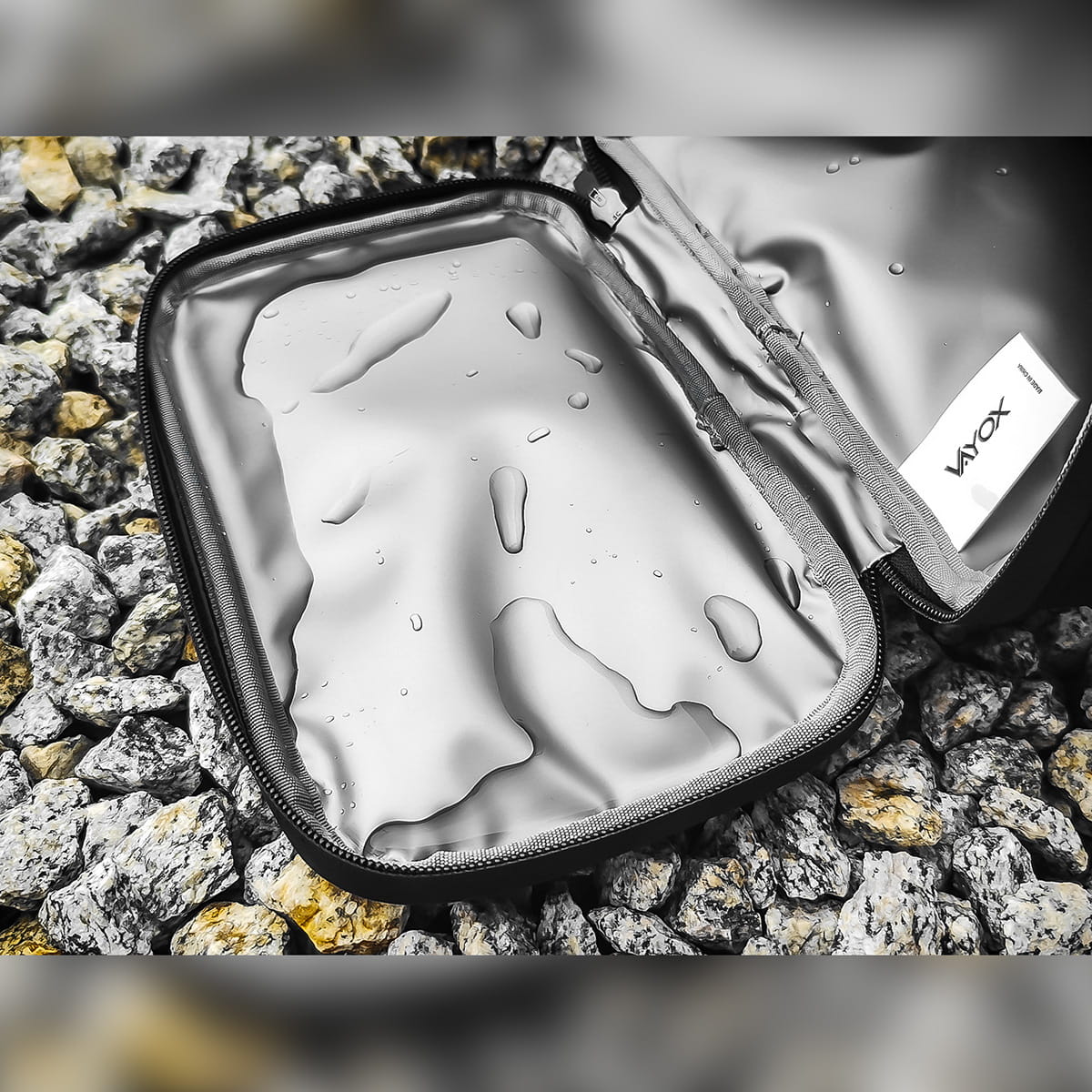 Open Vayox VA0167 bike handlebar bag showing insulated interior with water droplets on rocks, emphasizing thermal protection.