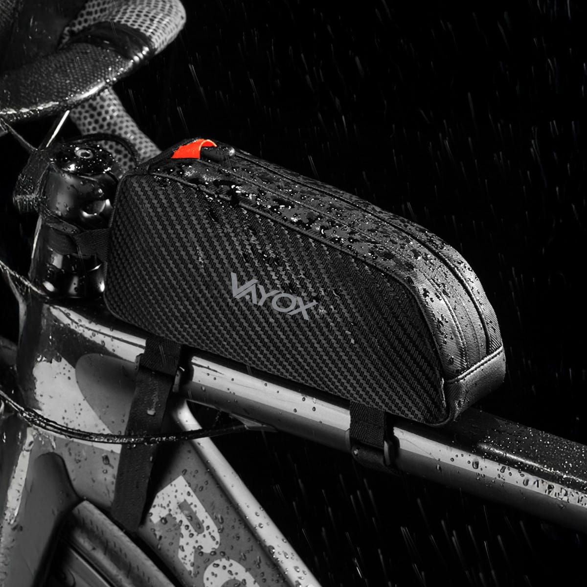 Vayox VA0347 black bike frame bag in rain, 1L capacity, attached to bicycle frame.