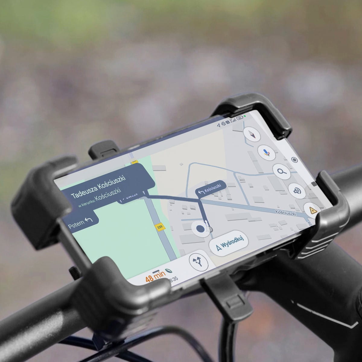 Smartphone mounted on a bicycle handlebar using the Vayox VA0344 holder, displaying a map, suitable for 4.5" to 7.2" screens.