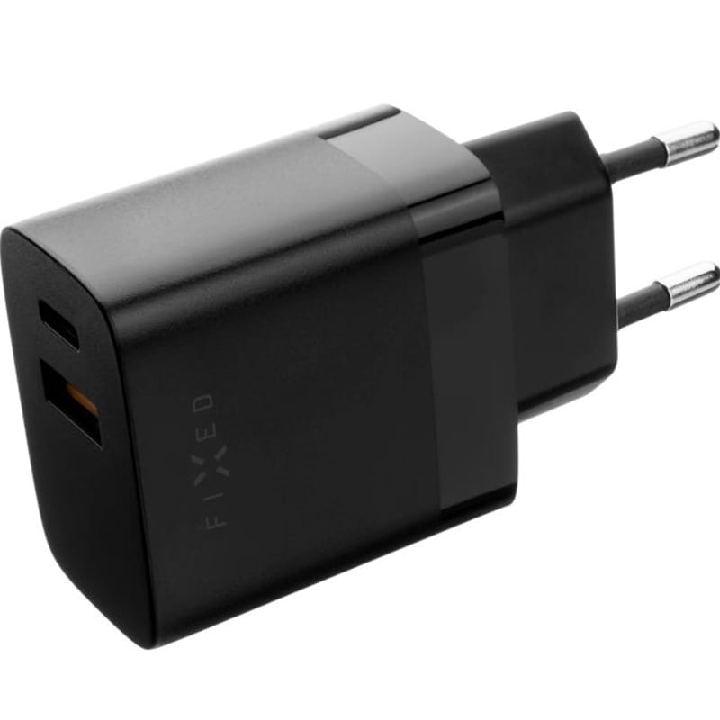 Schwarzes Fixed Travel Charger Ladegerät mit USB-C und USB-A Anschlüssen, ideal für Smartphones und Tablets, 20W Leistung.